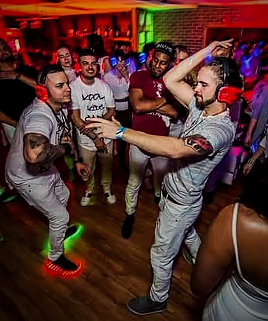 James leading a packed dance floor at a party